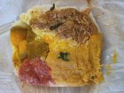 A typical school lunch of rice and curries all wrapped up to go