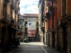 Balconies line this cobblestone residential street