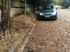Other streets, like this one, don't have a sidewalk. Do you see the bricks that make up the road?