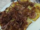 Fainá (chickpea flour flatbread) with carmelized onions... yum!