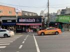 There are many different types of taxi cars with different colors, but similar to how NYC taxis are yellow, taxis in South Korea are orange