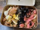 This is a fried rice dish topped with ham, seaweed and egg. We had to close the lid and shake it so that when we open it, everything was well mixed
