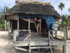 My friend Kalei in front of our shared beach fale in the village of Falealupo
