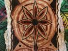 I painted this tapa, which is barkcloth made from the paper mulberry tree, with red and black ink using a seed as a brush