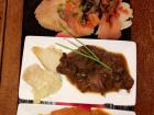 Tapas: Bread topped with salmon, beef stew, and curry chicken
