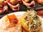 More tapas: bread with salmon (left) and bread with squid (right)