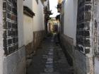 Narrow alley with unpaved roads 