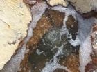 Volcanic water coming out of the salt flat