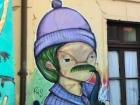 The man has green hair in this abstract street art!
