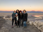 The sun setting in the desert behind me with some friends I met here in Chile