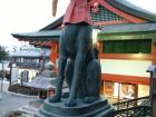 This is the Inari fox, the messengers of the god Inari, who guards the gate of the shrine