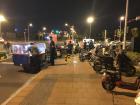 Food vendors gather on the corner at night