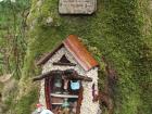 Visitors have left coins on the steps of this fairy house in order to achieve favor or avoid the anger of the fairy 