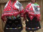 Two women dressed in traditional outfits 