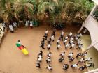 Students in school celebrate Cameroon at a daily march with the flag and every school has a dress code 