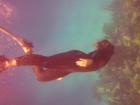 On the left of this photo of me freediving, is a red filter. This filter can be used to preserve the corals colors in deep sea diving so they aren't too blue. 