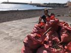 Helping clean up a beach with my school