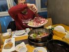 At a Shabu Shabu restaurant, you cook your own food in a large pot of broth