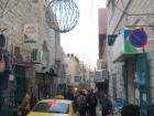 Taxi driving through the crowded and narrow streets of the Old City of Bethlehem