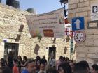 Orthodox Easter sign above the crowds in Bethlehem waiting for the Holy Fire
