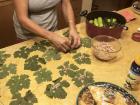 My Palestinian mom carefully rolling wa'ra' dawalee (stuffed grape leaves) with leaves fresh from the garden 