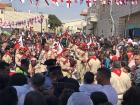 The scouts marching throughout the city playing the drums and bagpipes for Easter