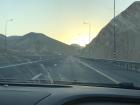 The sun setting while driving through the desert mountains toward Ramallah after visiting the Dead Sea