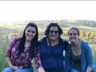 My mother, my roommate and I posing in front of the beautiful and lush green hills of my friend's village and a nearby vineyard