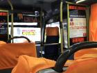 The bus interior looks like most busses, just a bit more cramped and a bit more colorful 