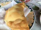 This is an Empanada, although this one is fried and most traditional Chilean Empanadas are baked