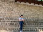Standing in front of the Deoksugung Palace walls