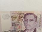 Two Singaporean dollars...you will want to “top up,” or add money, to your card