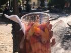 Fruits in a cup with lime, chile and a sauce called chamoy is a popular and delicious snack in Mexico!