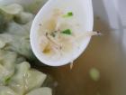 The wonton soup stock includes veggies and a lot of tiny shrimp