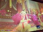 Traditional Chinese dance being played on a wall that is actually a big screen