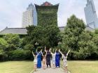 We wore traditional Chinese robes and dresses for a photoshoot in front of the school's central building