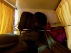 The inside of an overnight "sleeper" bus compartment