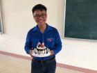 Here's Khôi on his birthday. His friend Oanh and I bought him pizza and a cake