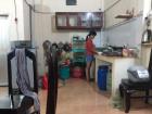 Here is Trân washing the dishes after dinner