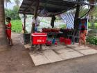 Everytime I go by here, kids are around to help their family sell drinks, fruit and cakes