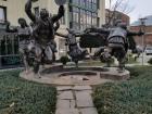 A sculpture standing outside of one of the larger hotels in the city