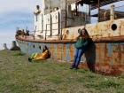 My friend and I leaning against an abandoned boat in Zugdidi.