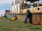 My friend and I leaning against an abandoned boat in Zugdidi.