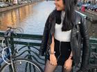 Here I am with the Amstel River in Amsterdam behind me. You can see how close the river is to the streets; if the water level rises too high, all of those sidewalks would be submerged (covered by water).