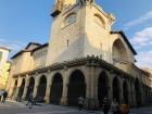 People walk by a church in the old part of town of Pamplona