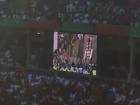 View of the running of the bulls on a screen inside the bullring in Pamplona