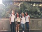 In front of the monument to the running of the bulls in our traditional San Fermín outfit of white clothing with a red handkerchief