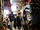 Some Orthodox Jews wander through the market in Jerusalem