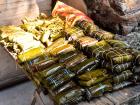 You can buy sticky rice steamed in a banana leaf at public markets