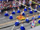 The costumes were very extravagant, but the woman in the middle holding a statue of Santo Niño has on the most extravagant outfit of all